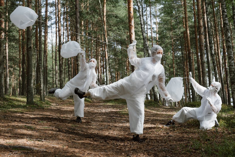 Three adults in protective suits cleaning a forest area, raising environmental awareness.